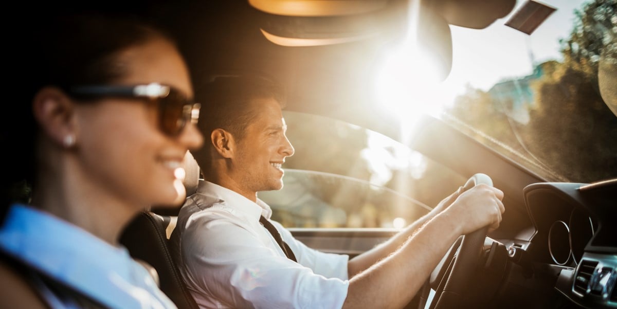 two people driving by car