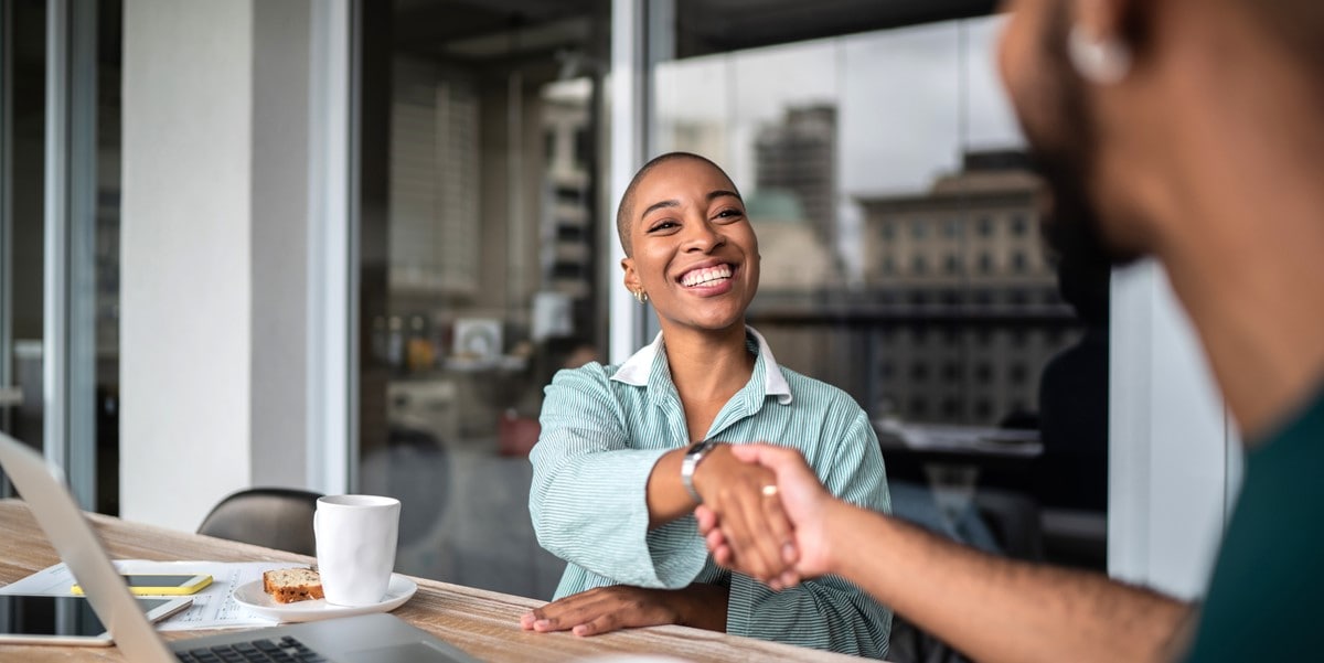 two people shaking hands